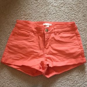 Salmon colored jean shorts